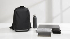 Purevave 16L black backpack with a laptop, water bottle, jacket, notebook, and accessory pouch